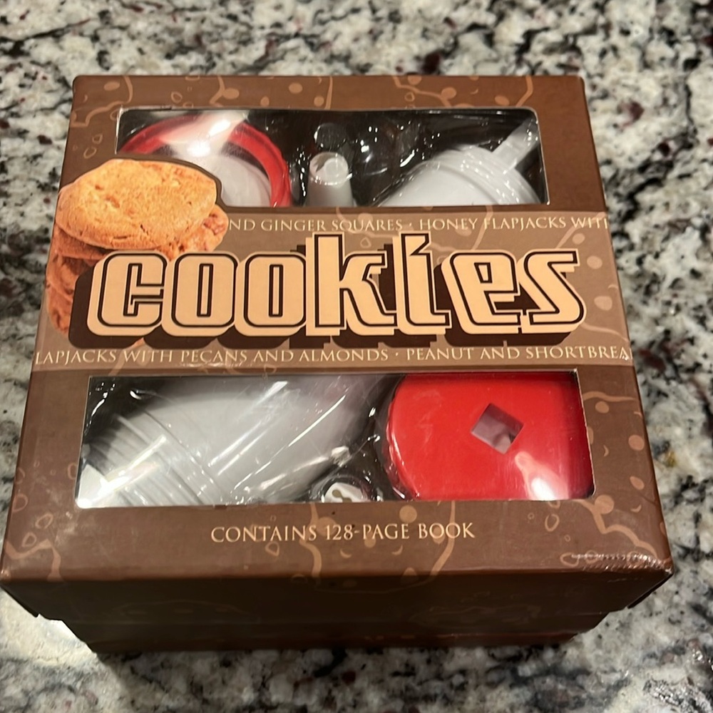 Cookie decorator and 128 page hard back cookie cookbook. New in box!